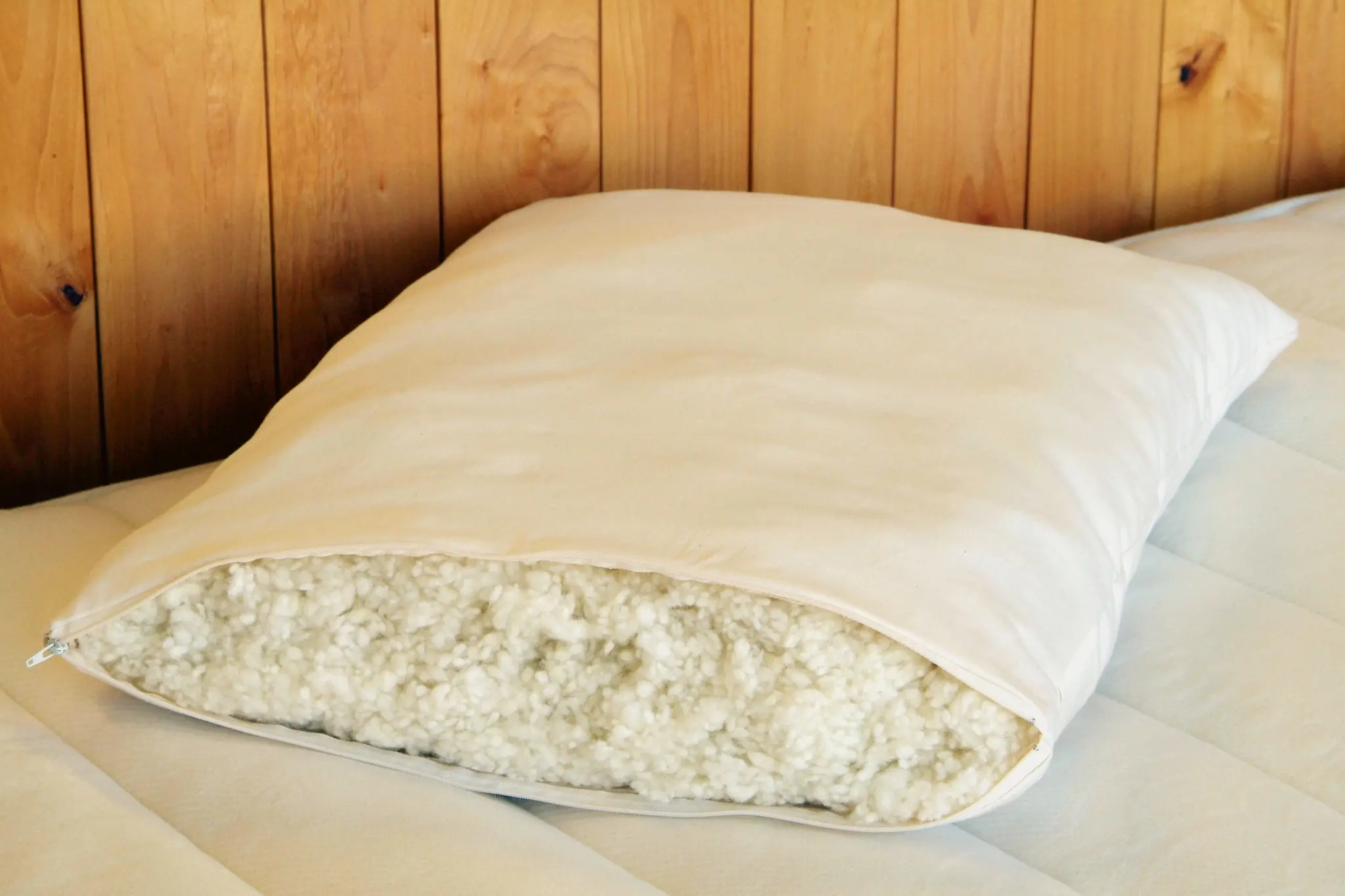 Organic wool pillow on bed