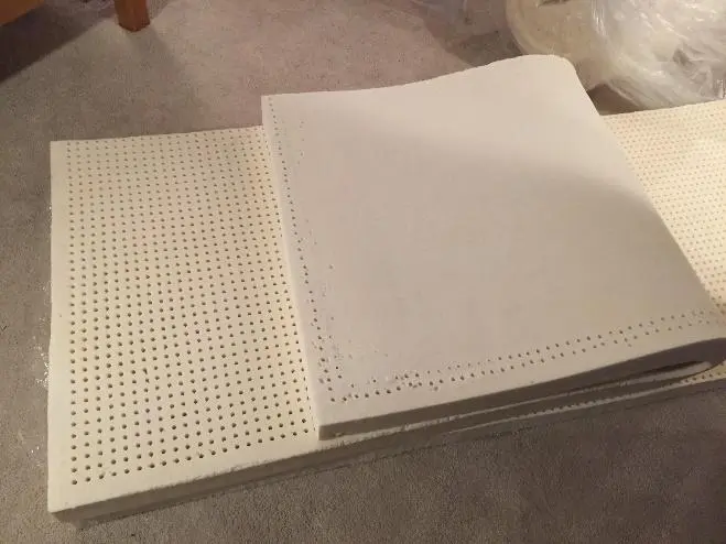 Natural latex layer with skin where top and bottom baking pins did not meet