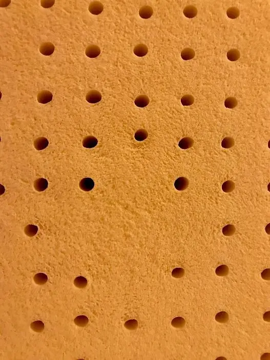 Natural latex area where baking pins were missing from the mold, does not affect performance