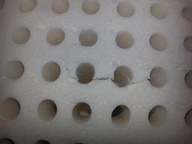 Small tears in natural latex foam from the manufacturing process, does not affect comfort