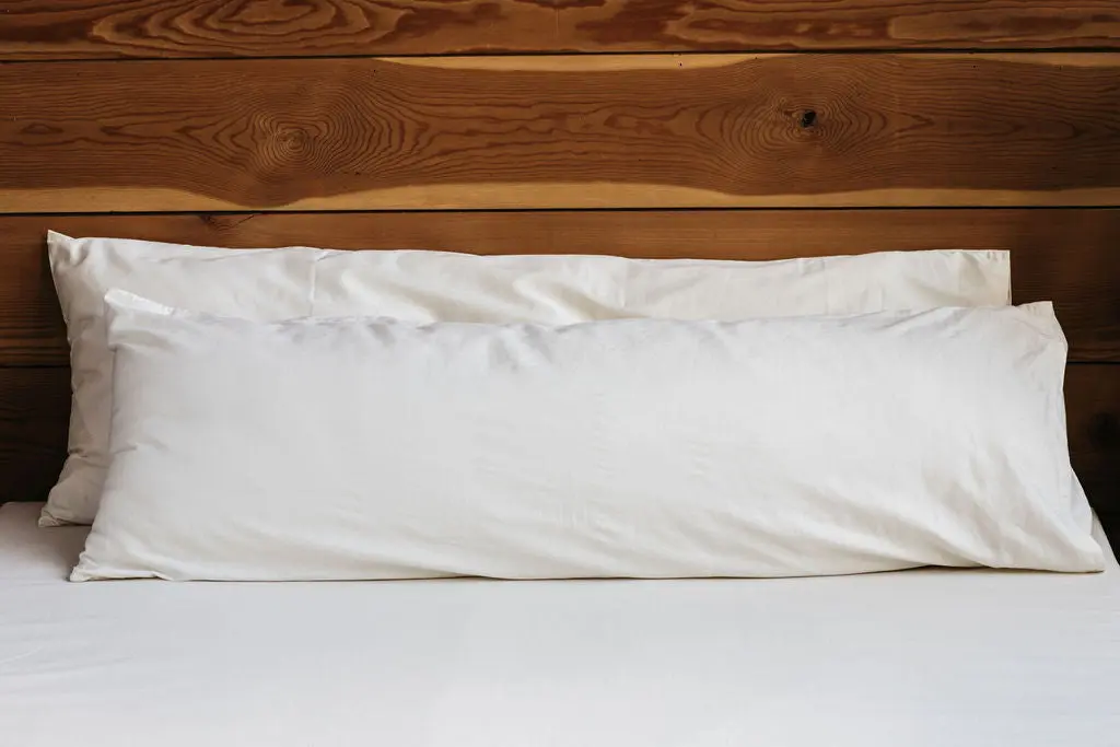 Certified organic body pillow filled with organic wool batting