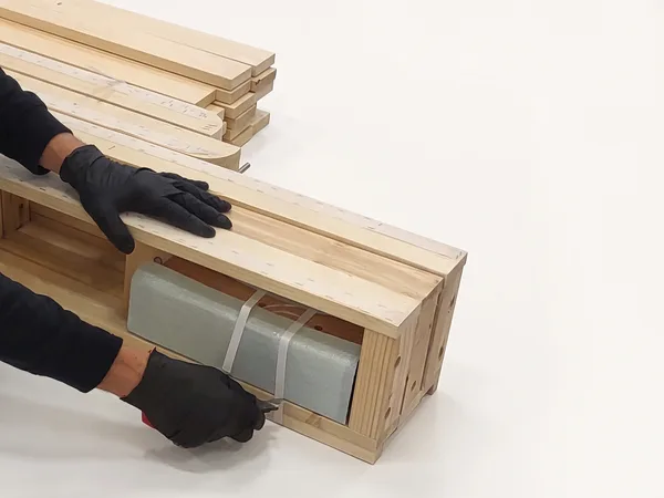 Heavy-duty foundation assembly step 4: Cut the bands that hold the rails together.
