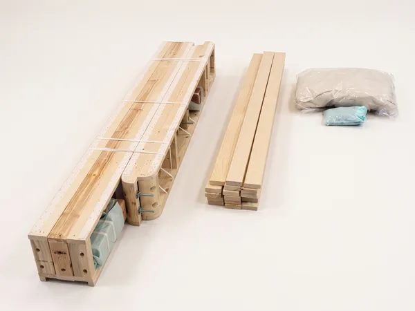 Heavy-duty foundation assembly step 5: Rails, slats, bolt kit and cover, ready to go.