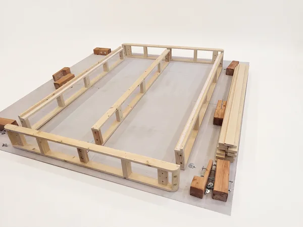 Heavy-duty foundation assembly step 6: Lay the rails out in position before bolting.