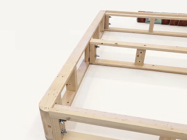 Heavy-duty foundation assembly step 12: Side rails and center rail bolted to one end rail. Repeat at the other end.