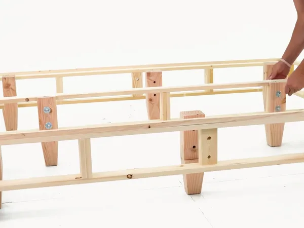 Heavy-duty foundation assembly step 15: Center-rail legs in place.