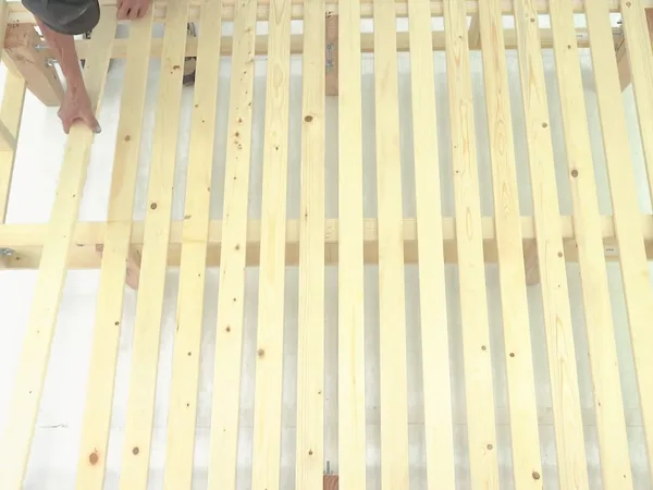 Heavy-duty foundation assembly step 21: Space the remaining slats evenly.