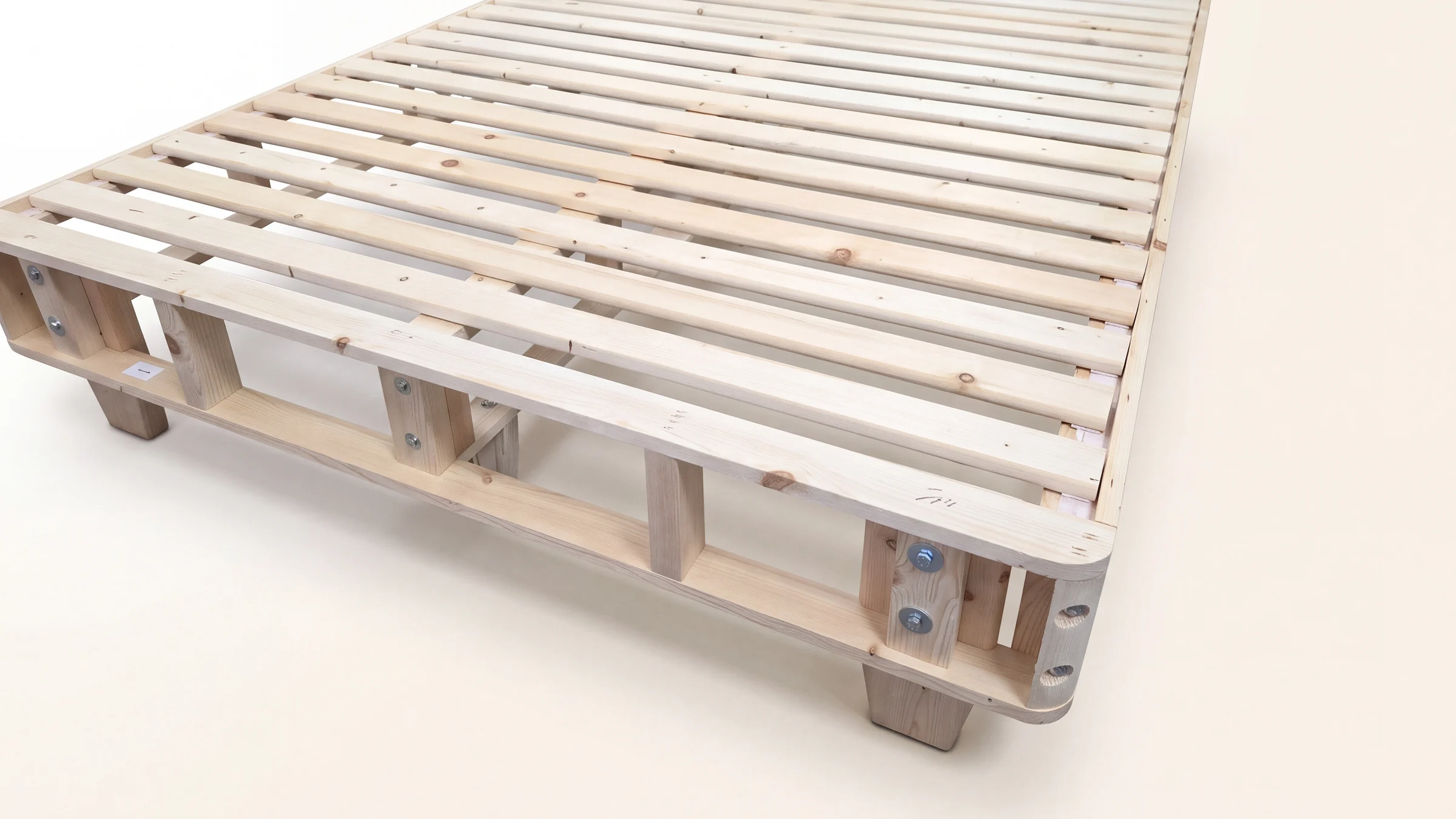 Inside the heavy-duty foundation: kiln-dried spruce slats, perimeter rails and double-bolted corner