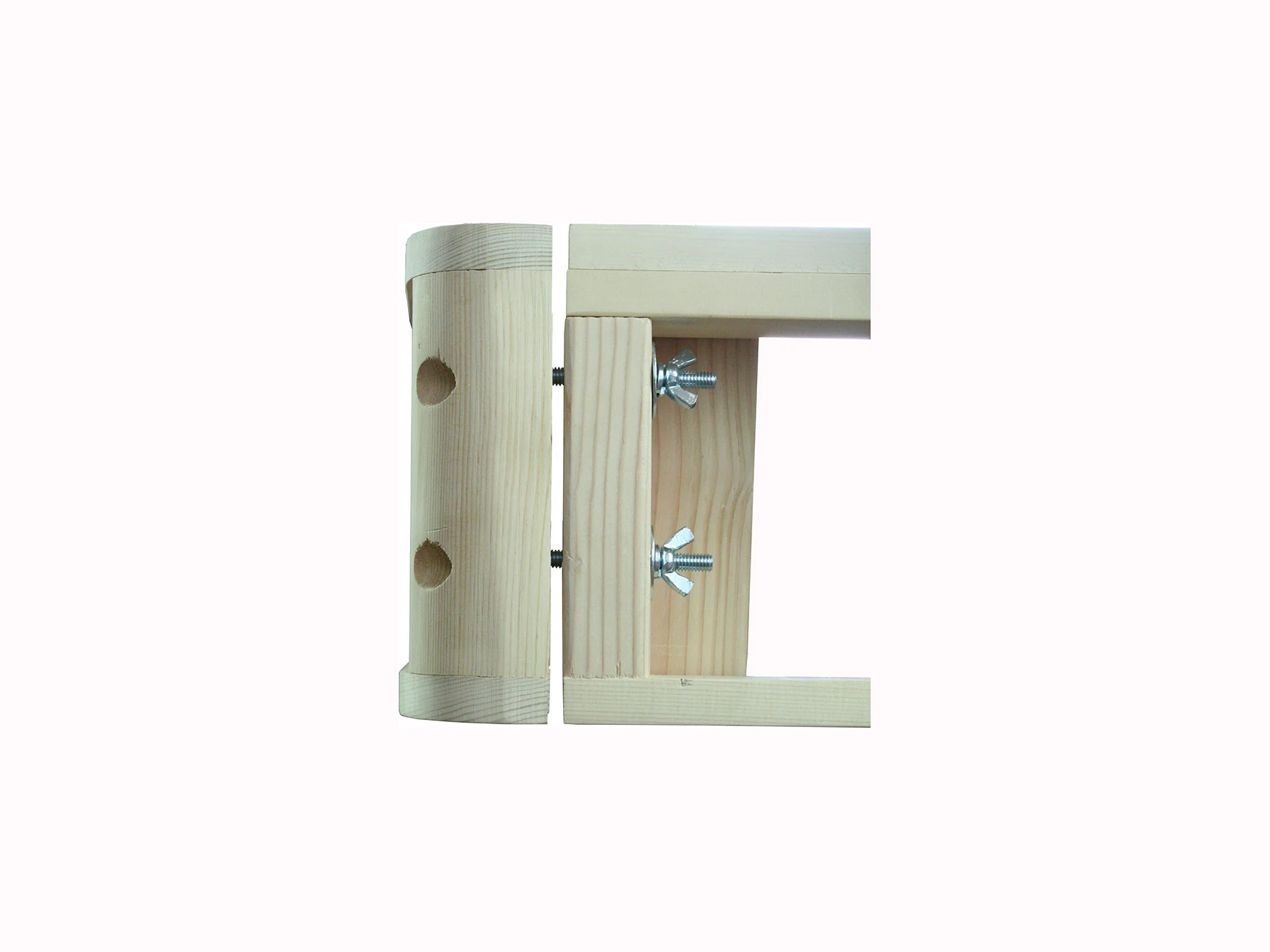 The two-bolt joint: rounded spruce corner post and rail held by two bolts with washers and wing nuts