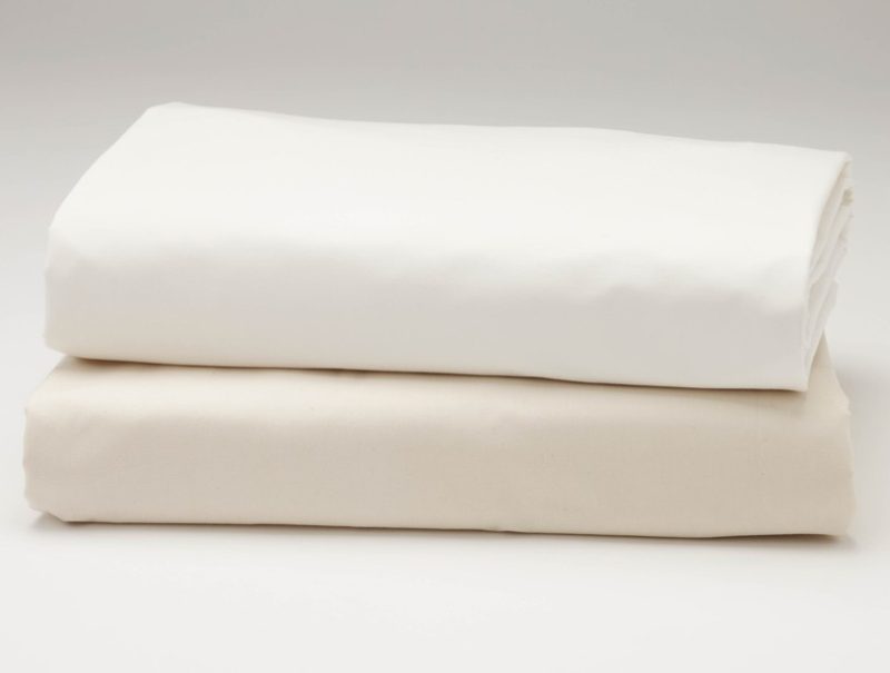 Organic cotton ombre sateen sheets on bed
