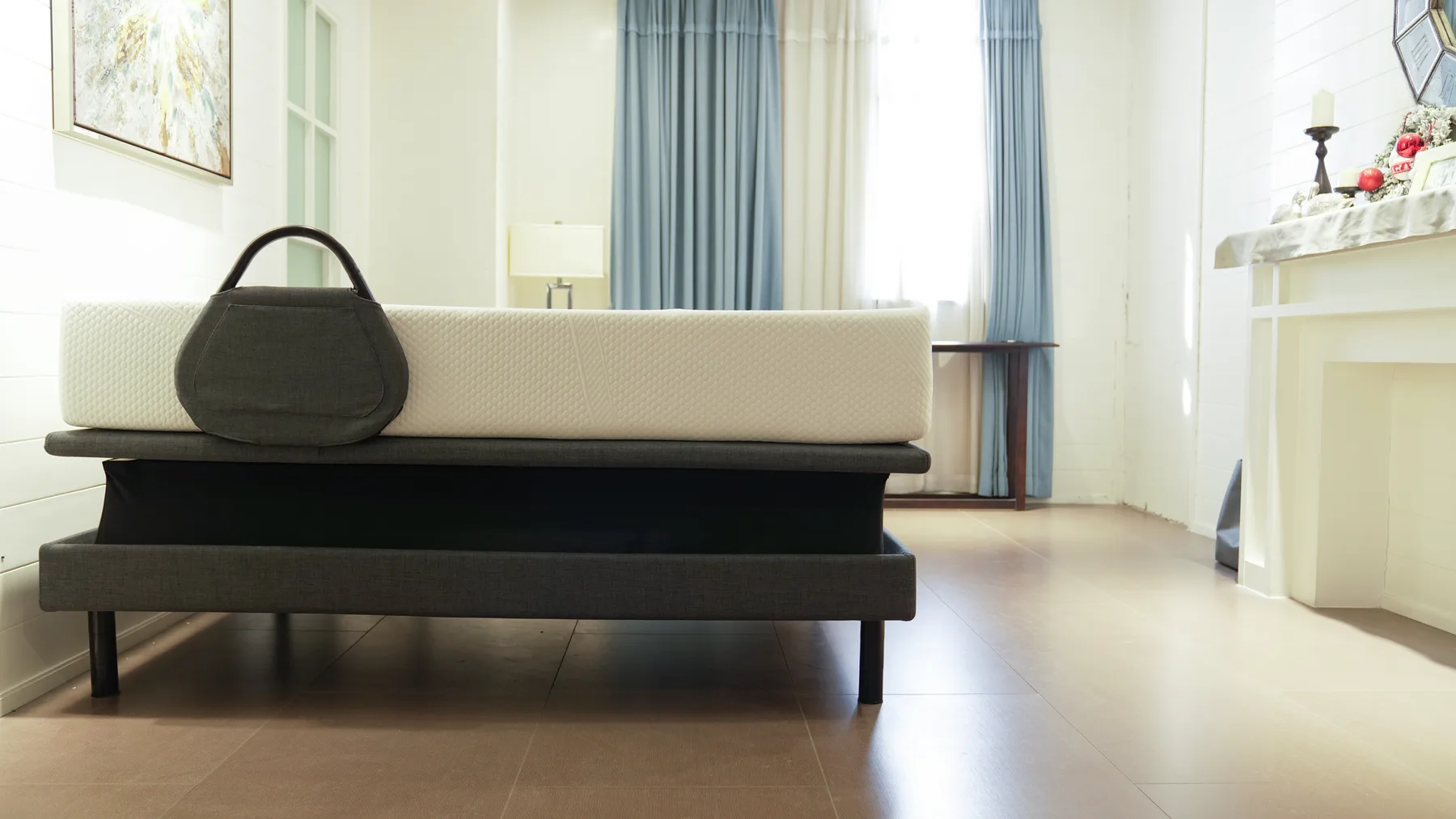Ergomotion Ascend raised toward caregiver height with the mattress lifted above the frame