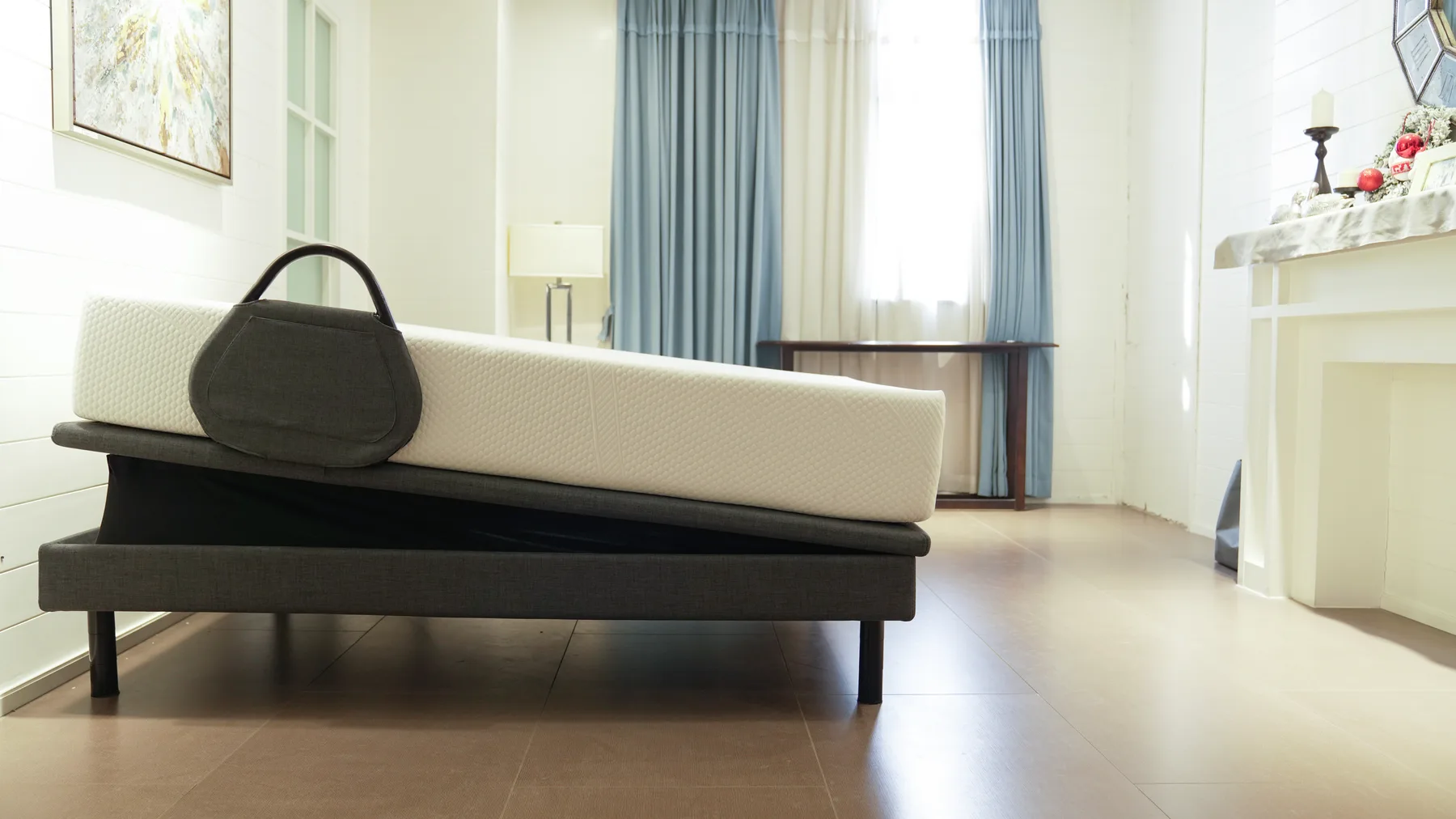 Ergomotion Ascend adjustable bed in full-bed tilt with the mattress angled head to foot