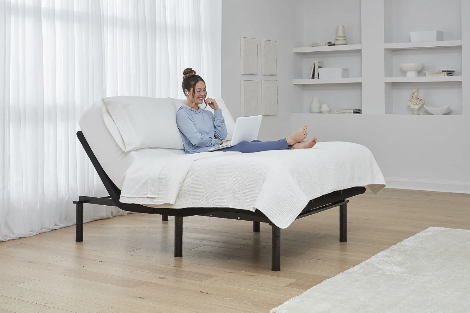 Ergomotion Rio 3.0 adjustable bed base with head raised in a bedroom