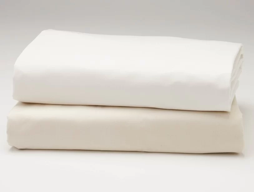 Organic cotton ombre sateen sheets on bed